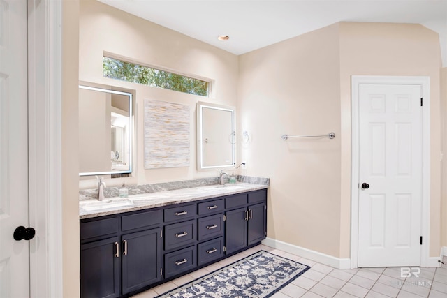 bathroom featuring tile patterned flooring and vanity