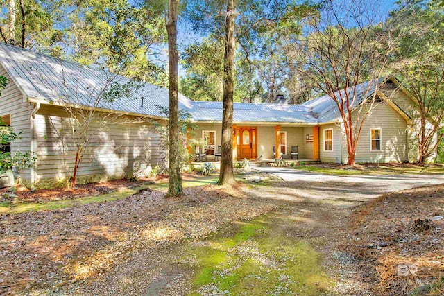 single story home featuring a patio