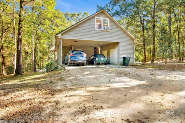 view of property exterior with a carport and cooling unit