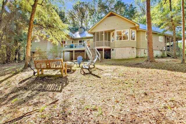 back of house with a sunroom