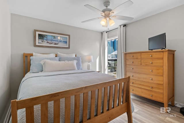 bedroom featuring light hardwood / wood-style flooring and ceiling fan