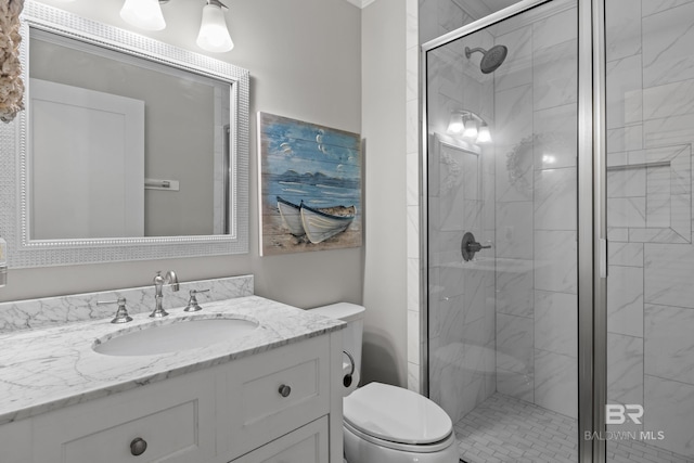 bathroom with vanity, toilet, and an enclosed shower