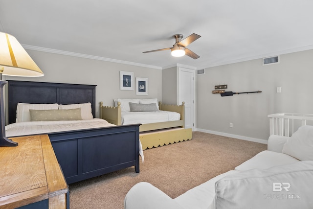 carpeted bedroom with ceiling fan and crown molding