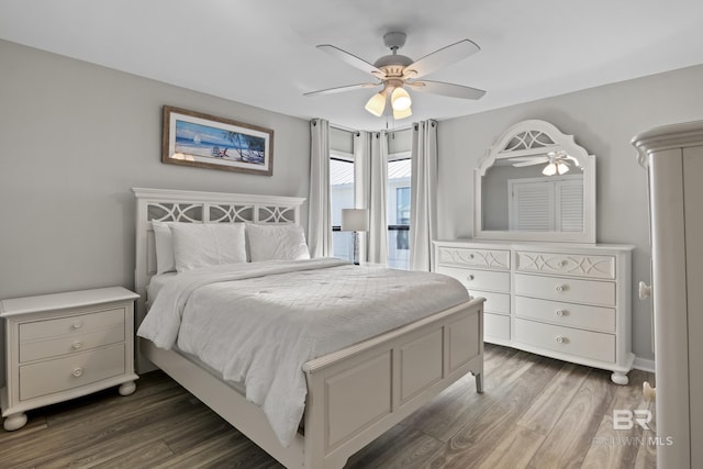 bedroom featuring ceiling fan and dark wood-type flooring