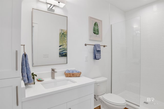 bathroom featuring an enclosed shower, toilet, and oversized vanity