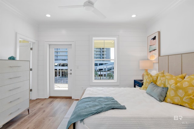 bedroom featuring ceiling fan, crown molding, light wood-type flooring, and access to outside
