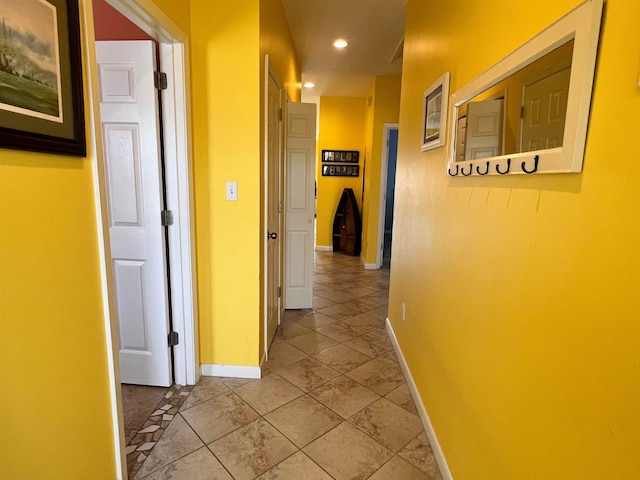 hallway with light tile floors