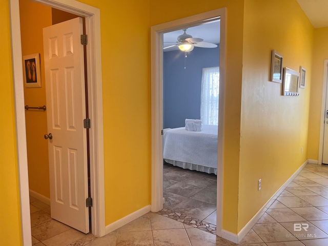 hallway featuring light tile floors