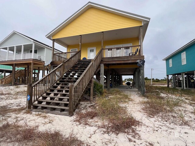 rear view of house with a wooden deck