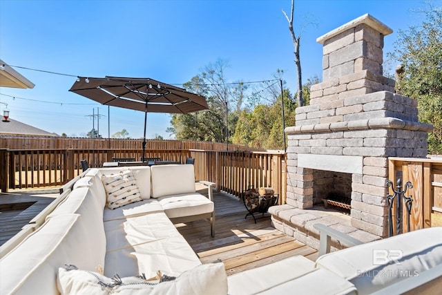 wooden terrace with an outdoor living space with a fireplace