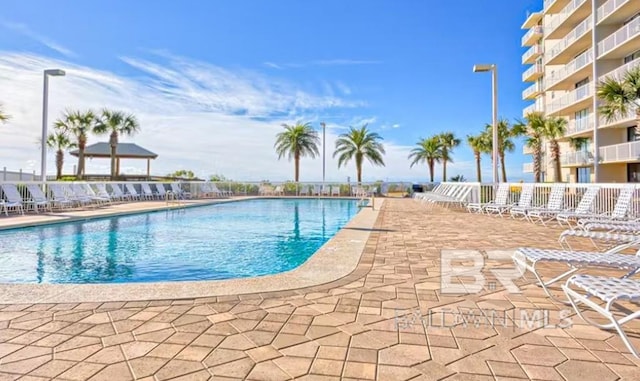 community pool featuring a patio area