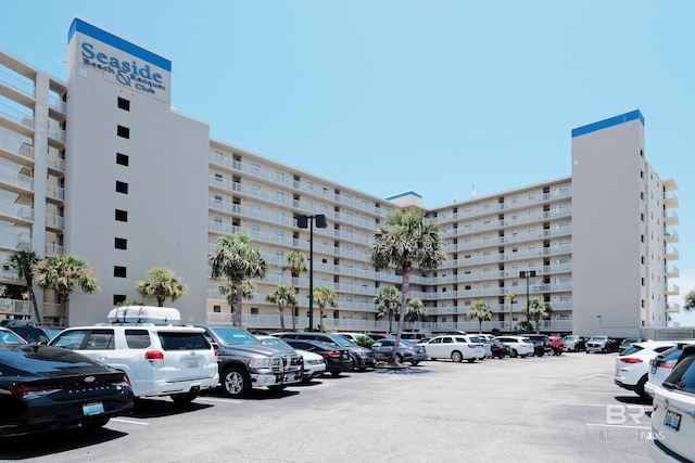 view of building exterior featuring uncovered parking