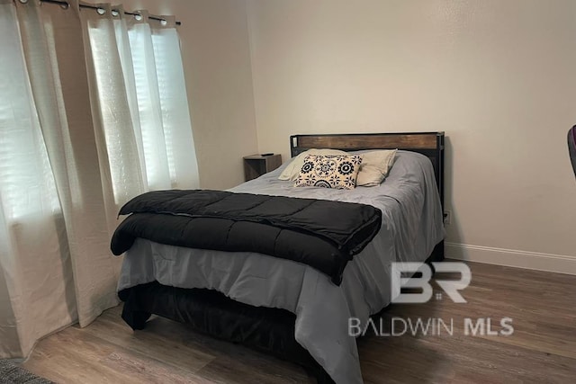 bedroom with hardwood / wood-style floors