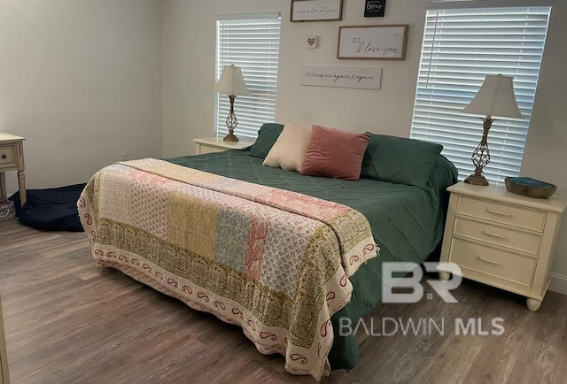 bedroom with hardwood / wood-style flooring