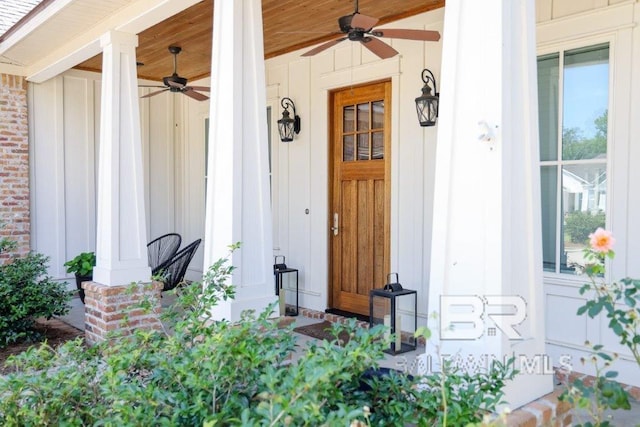 entrance to property featuring ceiling fan and a porch