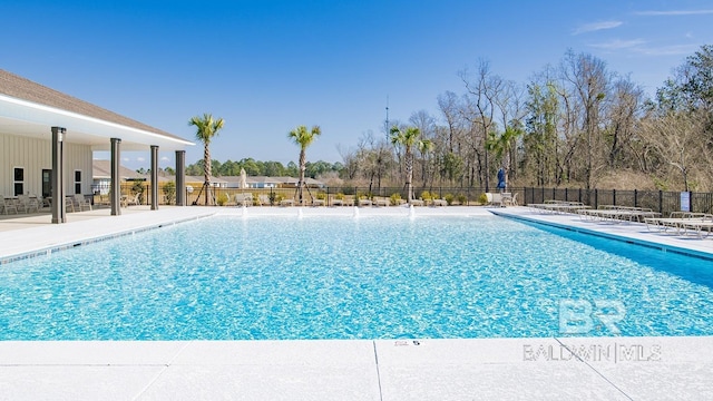 view of swimming pool with a patio