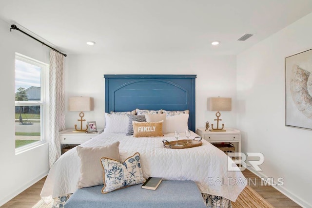 bedroom featuring hardwood / wood-style flooring