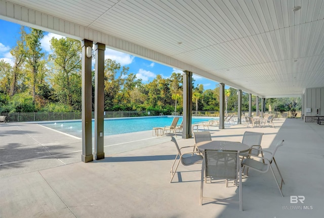 view of swimming pool with a patio area