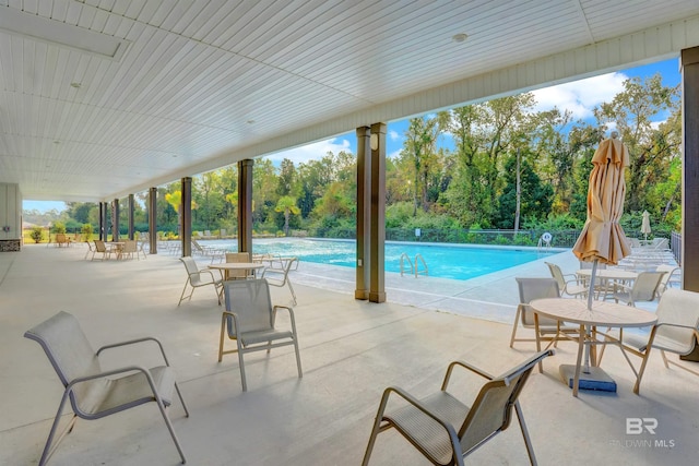 view of swimming pool featuring a patio area