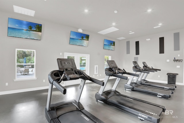 gym featuring french doors and plenty of natural light