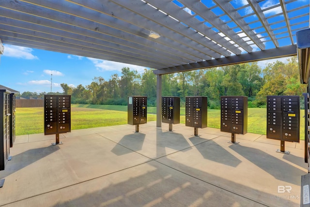 view of patio / terrace featuring a mail area and elevator