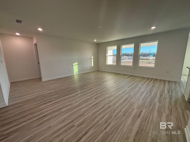 spare room with light wood-type flooring