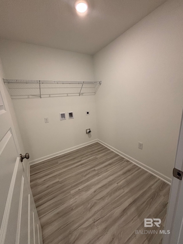 laundry area with electric dryer hookup, dark wood-type flooring, and hookup for a washing machine