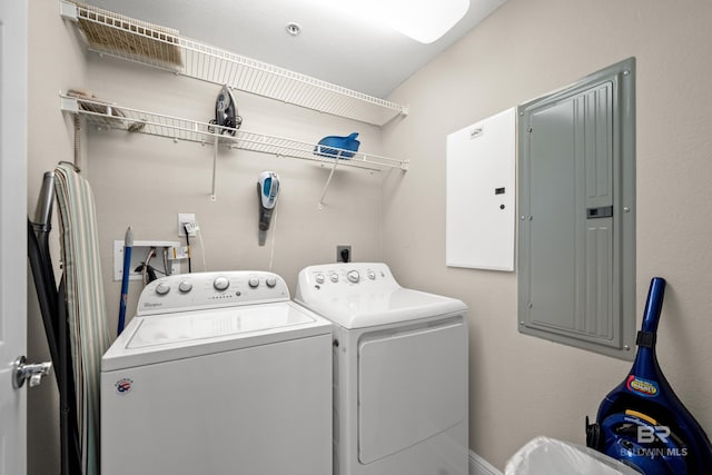 washroom featuring independent washer and dryer and electric panel