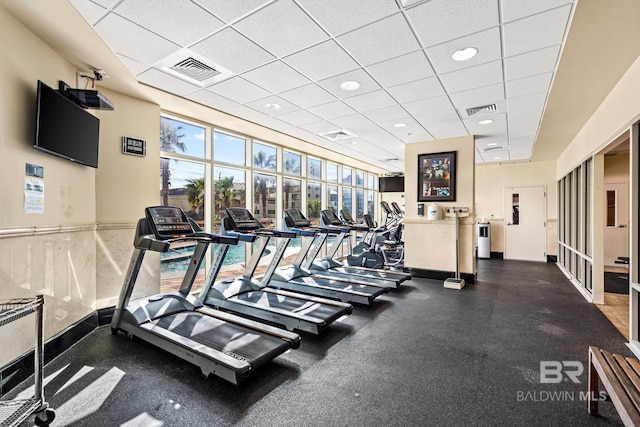 gym featuring a drop ceiling