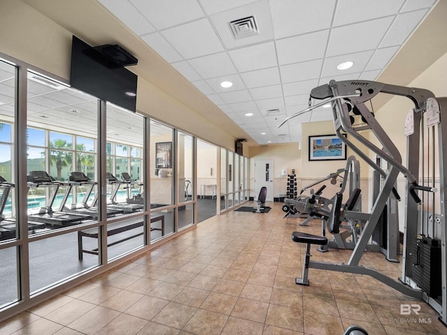 workout area featuring a paneled ceiling