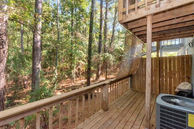 wooden deck featuring central AC unit