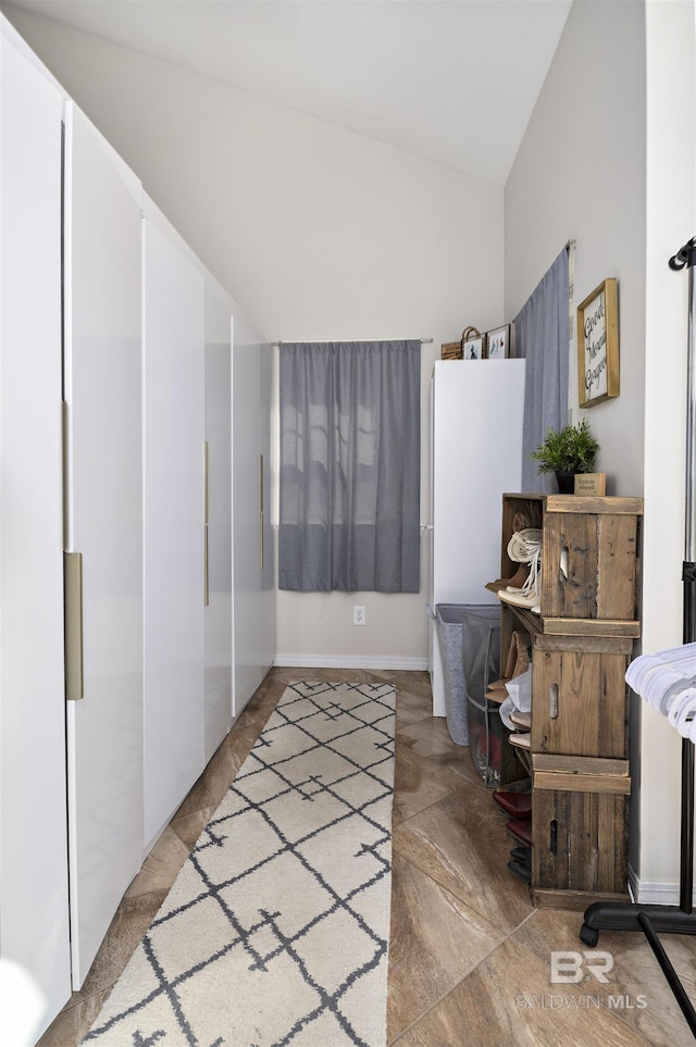 bathroom with lofted ceiling