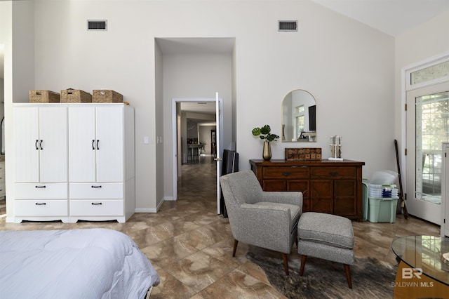 bedroom featuring visible vents, high vaulted ceiling, and baseboards