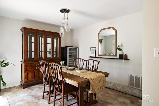 dining room with visible vents and baseboards