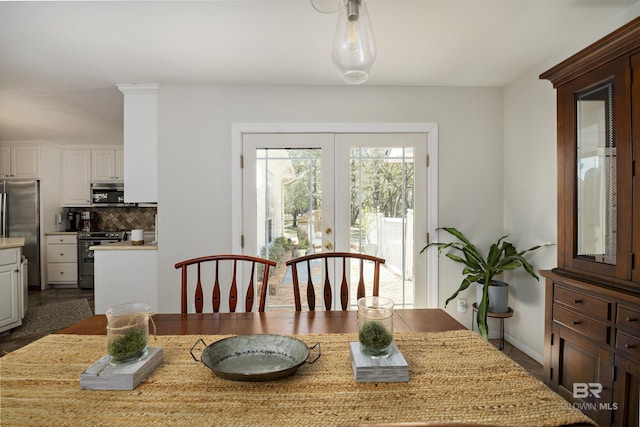 dining space featuring french doors