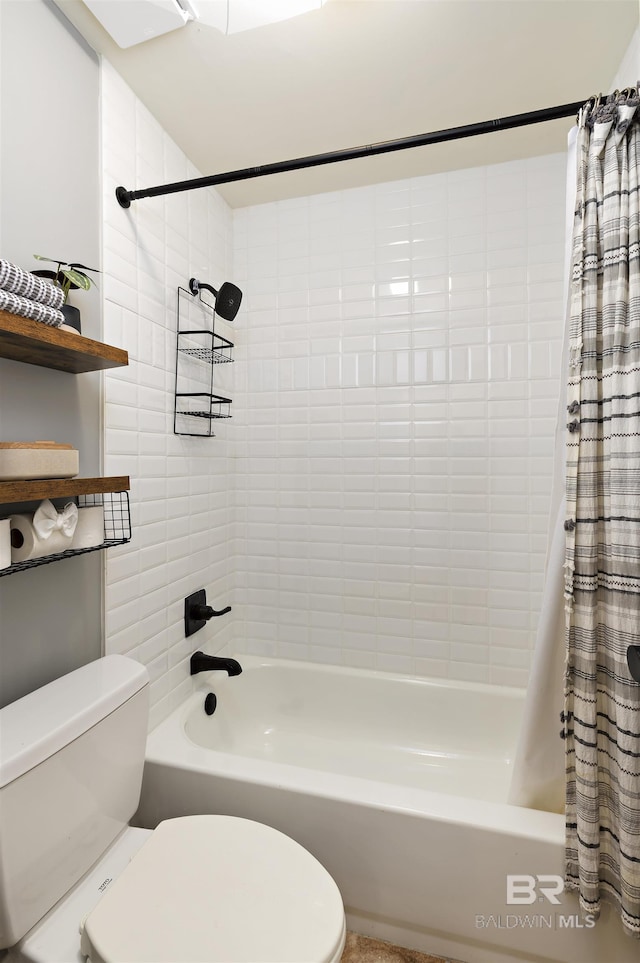 bathroom featuring toilet and shower / bath combo with shower curtain