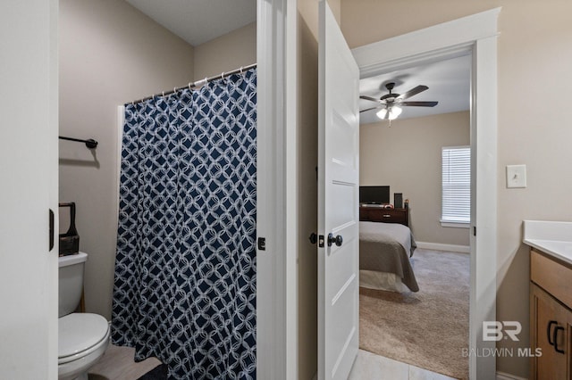 bathroom with vanity, ceiling fan, and toilet