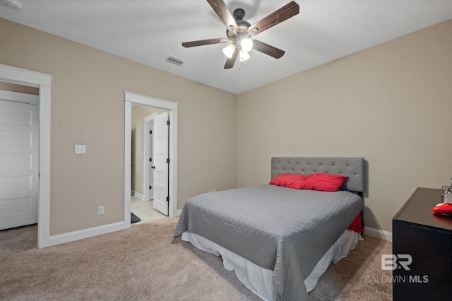 bedroom featuring ceiling fan and light colored carpet