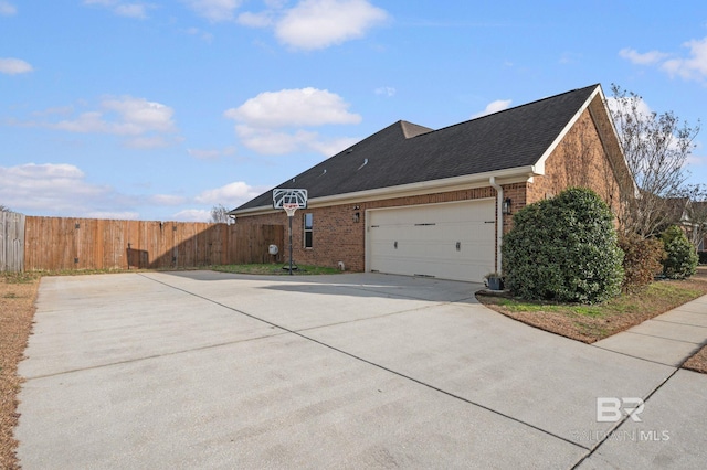 view of side of property with a garage