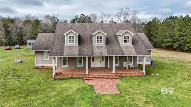 cape cod home with crawl space, roof with shingles, central AC, and a front yard