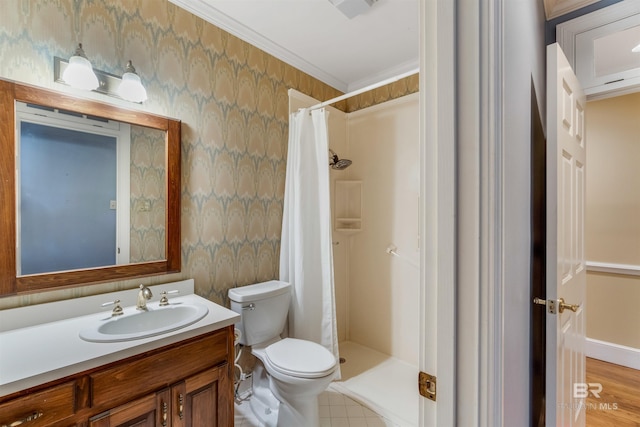 bathroom with crown molding, a shower stall, vanity, and wallpapered walls