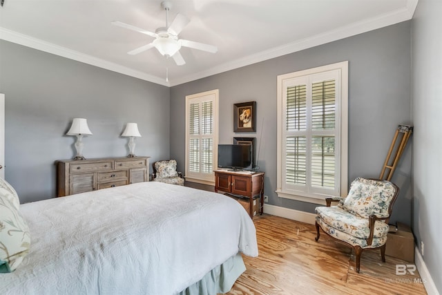 bedroom featuring light wood-type flooring, baseboards, and crown molding