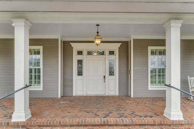 property entrance with covered porch