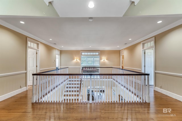 unfurnished room with recessed lighting, wood finished floors, and crown molding