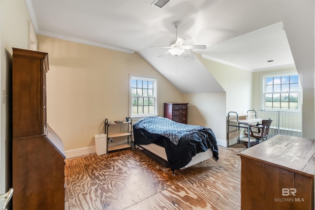 bedroom with ornamental molding, lofted ceiling, multiple windows, and baseboards