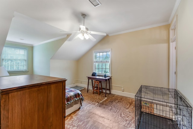 bedroom with ornamental molding, visible vents, vaulted ceiling, and baseboards