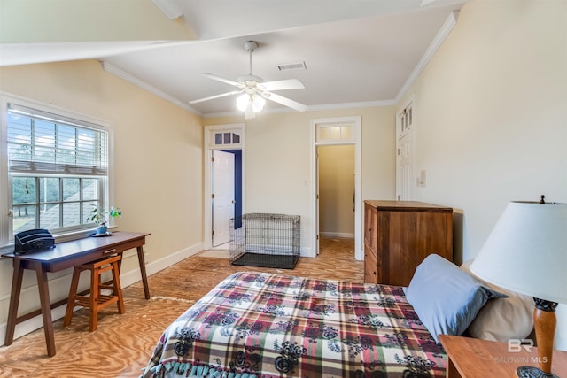 bedroom featuring baseboards, visible vents, light wood-style flooring, and ornamental molding