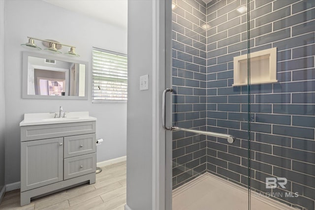 42 W Lourando Dr, Mobile, AL 36606 - bathroom with a shower stall, vanity, and wood finished floors