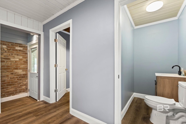 42 W Lourando Dr, Mobile, AL 36606 - bathroom featuring brick wall, crown molding, wood finished floors, and vanity