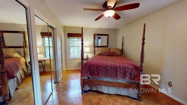 bedroom with light parquet floors and ceiling fan